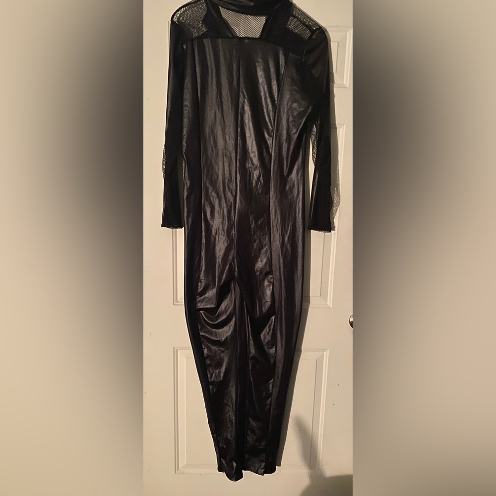 Star-line La Costume.Black catsuit with some accessories.